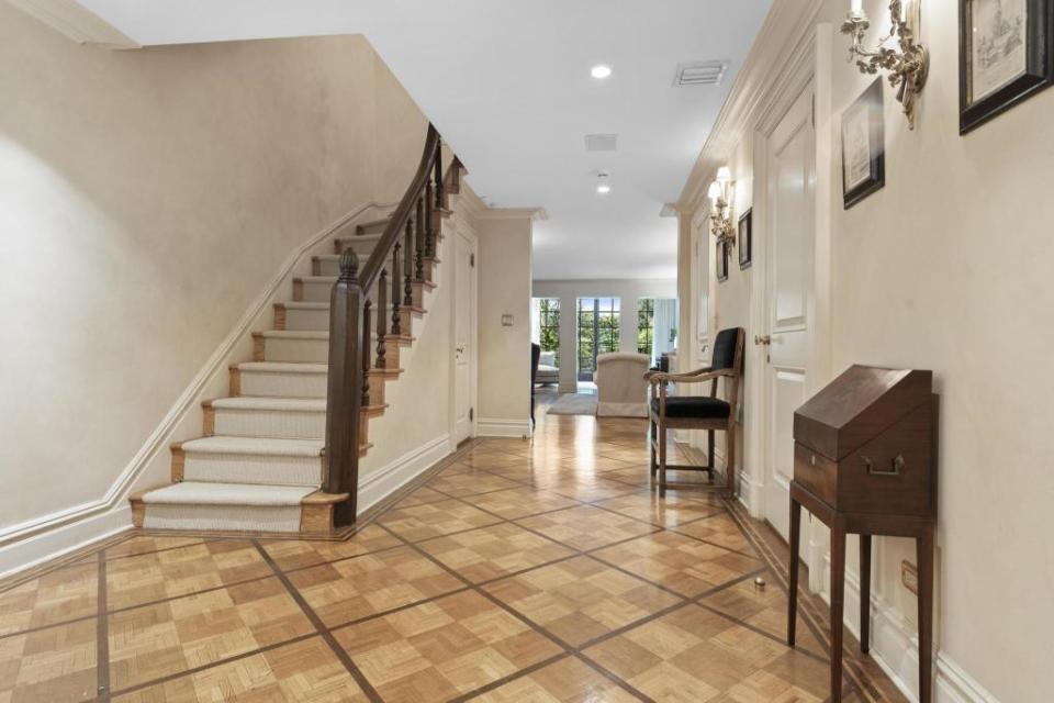 Patterned hardwood floors in the foyer. Concierge Auctions