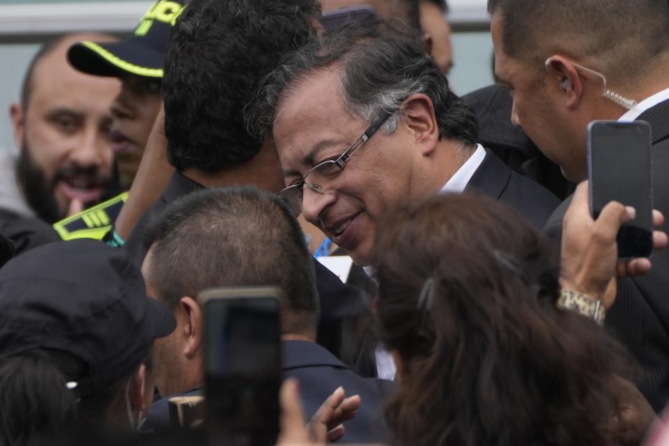 President-elect Gustavo Petro smiles during a 'popular and spiritual' inauguration ceremony presided over by local Indigenous groups and feminist activists, in Bogota, Colombia, Saturday, Aug. 6, 2022. (AP Photo/Ariana Cubillos)