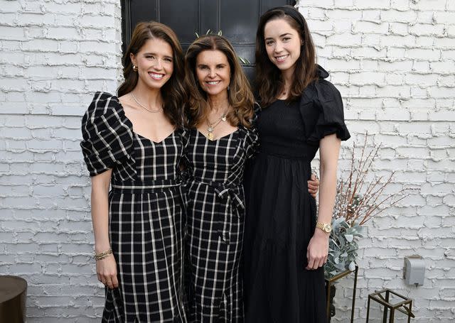 <p>Michael Kovac/Getty </p> Katherine Schwarzenegger, Maria Shriver and Christina Schwarzenegger at the launch of Katherine's new holiday collection with Cleobella.