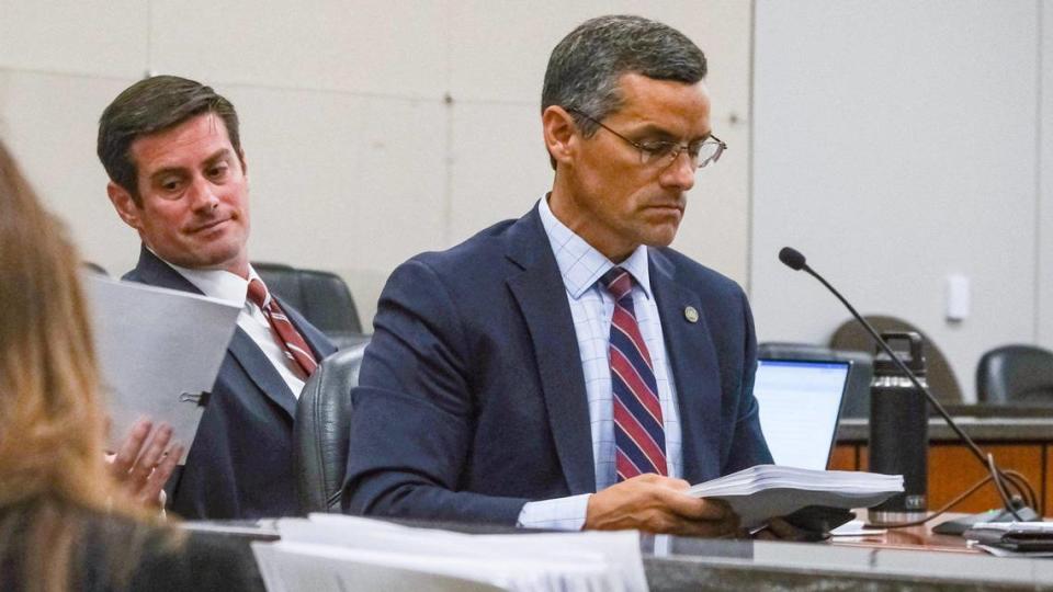 San Luis Obispo County Deputy District Attorney Chris Peuvrelle, left, reaches for papers behind Assistant District Attorney Eric Dobroth during pretrial motions for Paul and Ruben Flores in the Kristin Smart murder case, in Salinas, California, on June 6, 2022. Paul Flores is alleged to have killed Kristin Smart after an off-campus Cal Poly party in May 1996. He was the last person seen with the Cal Poly student. Ruben Flores, Paul Flores’ father, is charged with accessory after the fact. The two were arrested in April 2021 — 25 years after Smart’s disappearance. Smart’s body has never been found. Change of venue was granted to move the trial from San Luis Obispo to Monterey County.