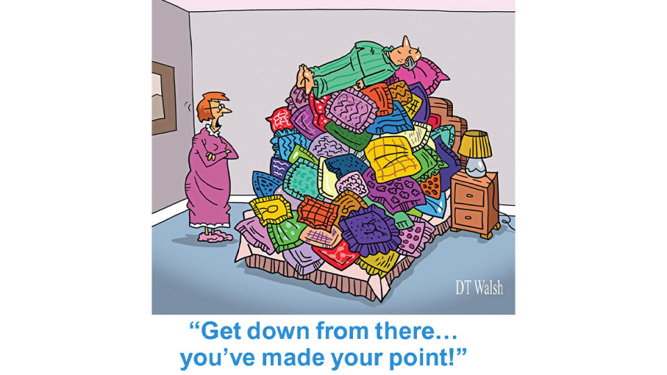 Cartoon of husband on a huge pile of throw pillows and wife saying, 
