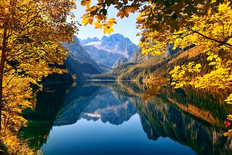 Cycle past mountain-fringed lakes - Credit: GETTY