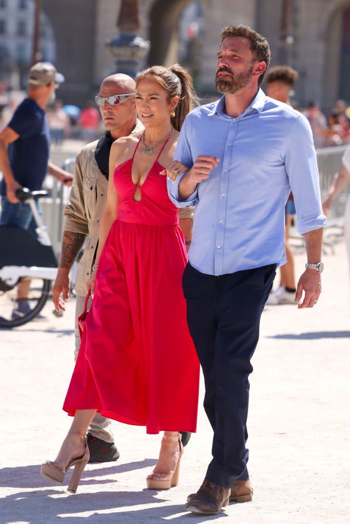 <p>She chose a plunging hot pink dress with nude platform heels for a stroll with her new hubby in Paris. </p>