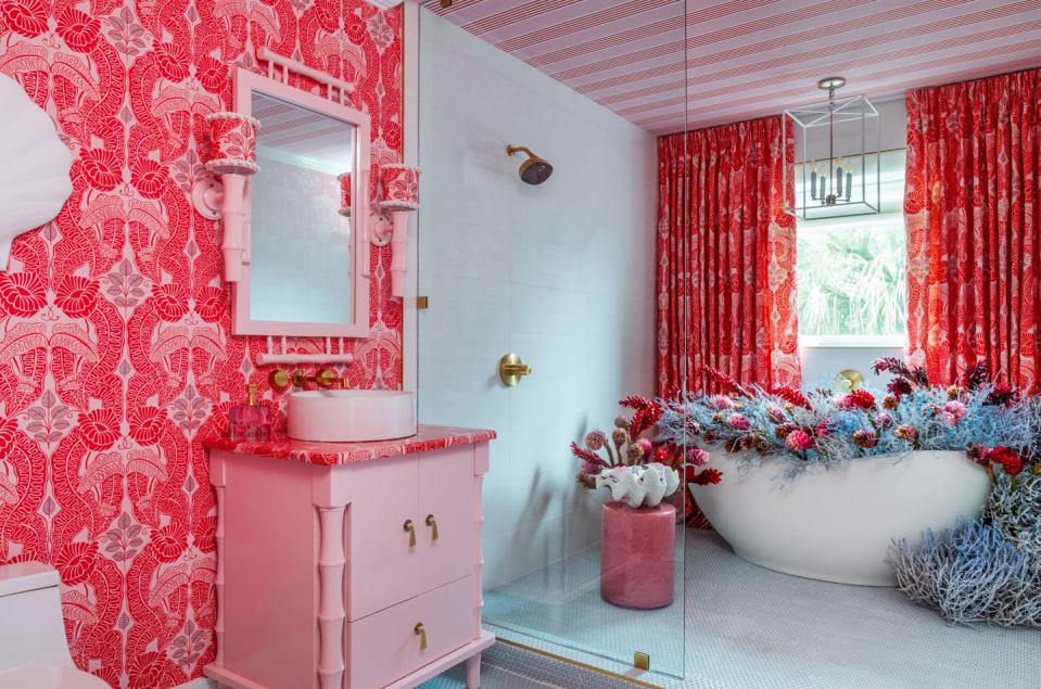 a bathroom with pink walls