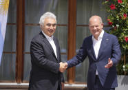 German Chancellor Olaf Scholz, right, greets International Energy Agency Executive Director Fatih Birol during the official welcome ceremony of G7 leaders and Outreach guests at Castle Elmau in Kruen, near Garmisch-Partenkirchen, Germany, on Monday, June 27, 2022. The Group of Seven leading economic powers are meeting in Germany for their annual gathering Sunday through Tuesday. (AP Photo/Matthias Schrader)