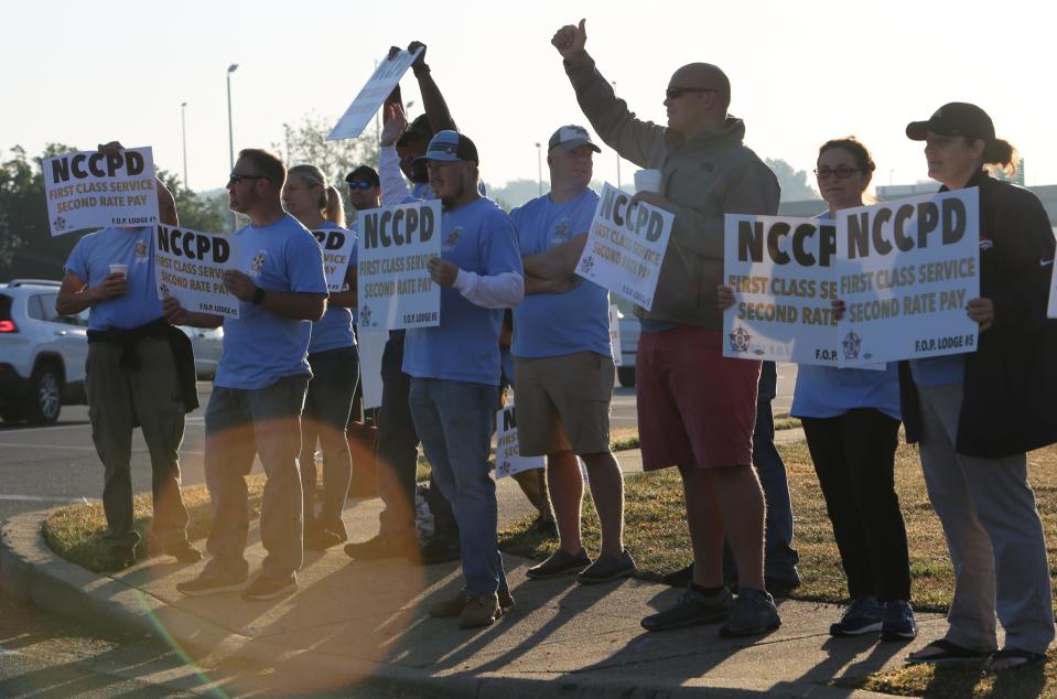 New Castle County police officers protested outside the Christiana Hilton Friday morning.  They have been working for about six months without a contract.  Inside the hotel, New Castle County Executive Matt Meyer was giving a speech.