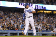 Los Angeles Dodgers' Max Muncy scores after hitting a solo home run during the third inning of a baseball game against the Minnesota Twins Tuesday, Aug. 9, 2022, in Los Angeles. (AP Photo/Mark J. Terrill)