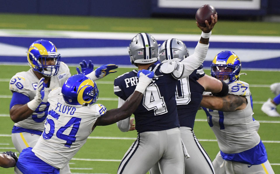 Outside linebacker Leonard Floyd (54) of the Los Angeles Rams pressures quarterback Dak Prescott (4) of the Dallas Cowboys in the first half of a NFL football game on opening night at SoFi Stadium in Inglewood on Sunday, September 13, 2020. (Keith Birmingham/The Orange County Register via AP)