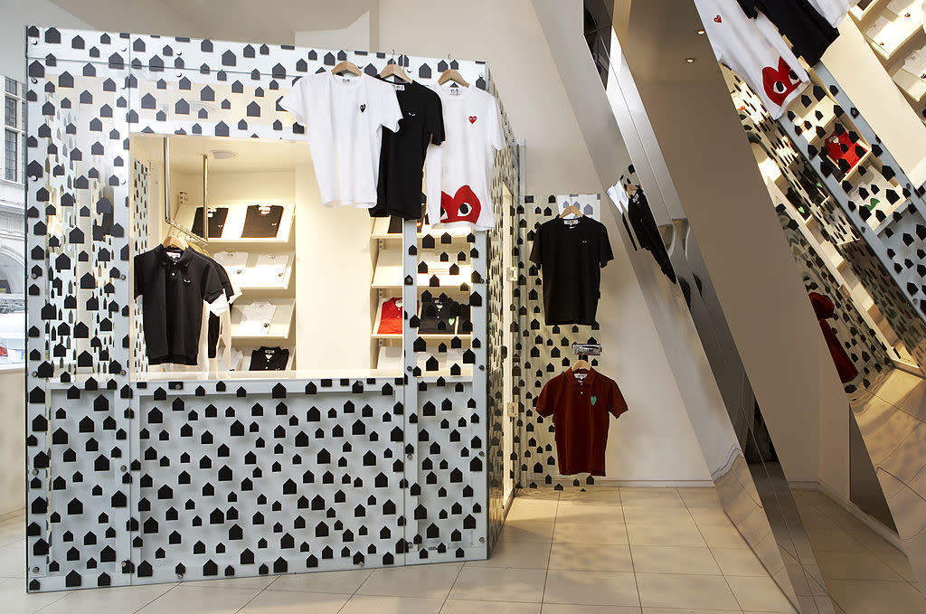 Dover Street Market, Dover Street, London, W1, United Kingdom, Architect: Rei Kawakubo, 2006, Dover Street Market, Rei Kawakubo, 2006, London, View Of Stall Selling T-Shirts, Mirror On Side (Photo by View Pictures/UIG via Getty Images)