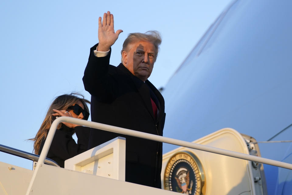 President Donald Trump waves as he boards Air Force One at Andrews Air Force Base, Md., Wednesday, Dec. 23, 2020. Trump is traveling to his Mar-a-Lago resort in Palm Beach, Fla. (AP Photo/Patrick Semansky)