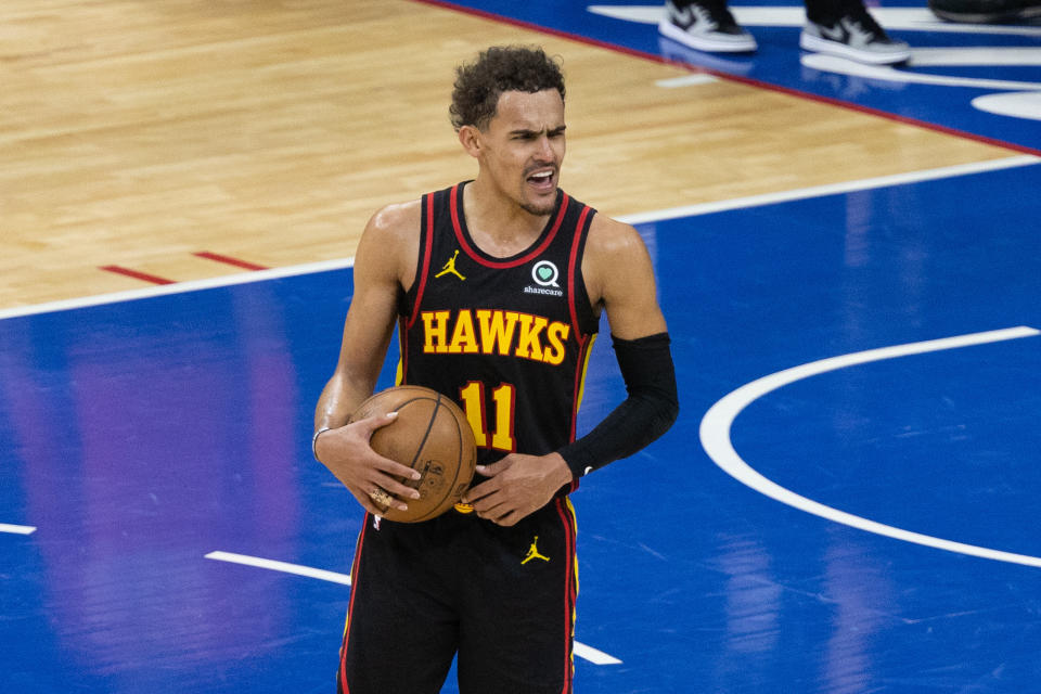 Trae Young reacts and celebrates in the closing seconds of Game 7.