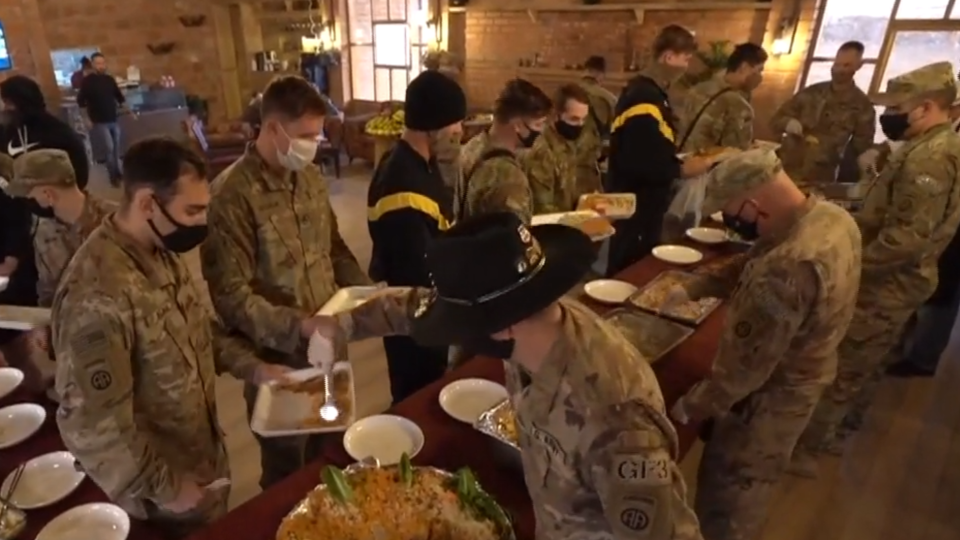 U.S. service members take part in a Thanksgiving celebration in Syria on November 26, 2020. 