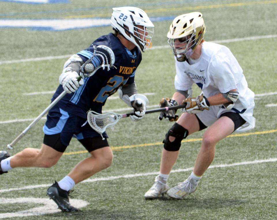 Cape Henlopen's Charles Fritchman tries to get past Aldan Lucey of Salesianum during the DIAA Boys Lacrosse championship game on Saturday at Dover High.