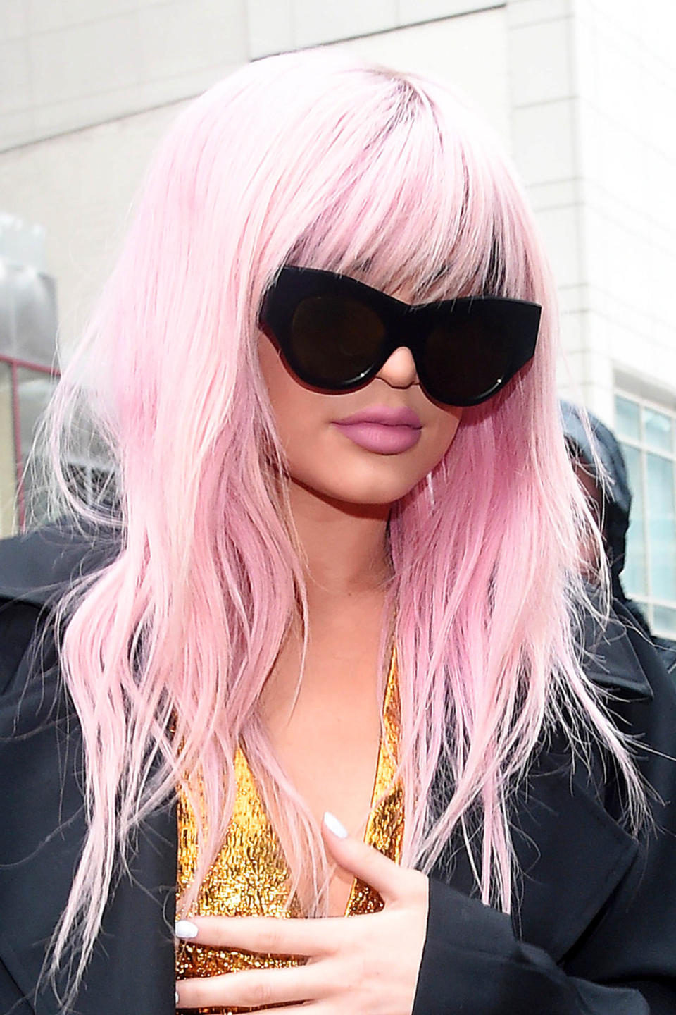 <p>Unnaturally pink (because it's a wig) while attending Vera Wang's fashion show in February 2016.</p>