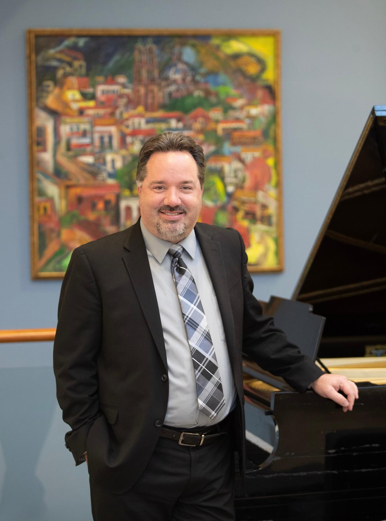 Britt Cooper is the professor of choral music and coordinator of visual and performing arts at Walsh University in North Canton. He lives in Lake Township with his wife, Heather and his two children: Megan, 11, and Mark, 8.