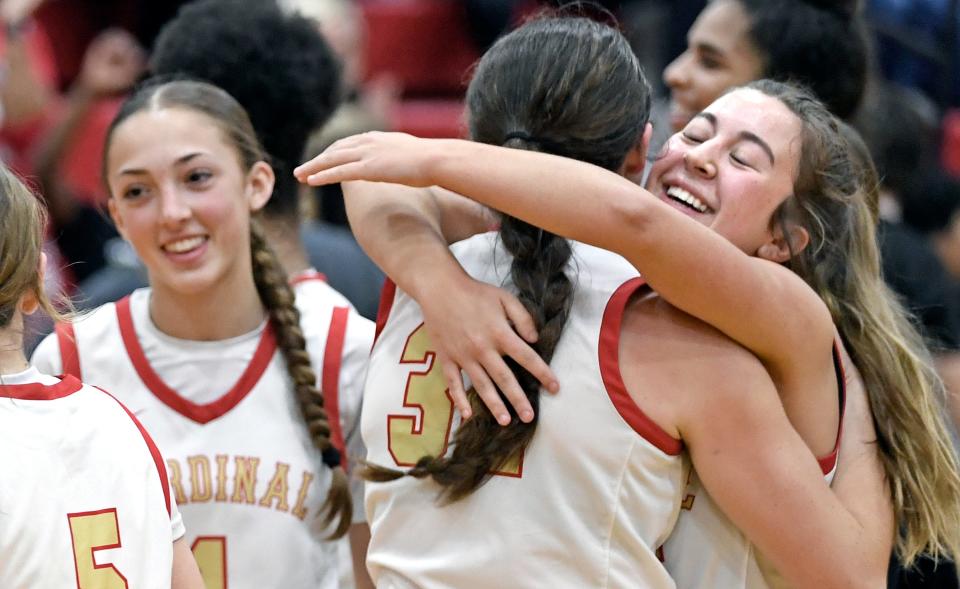 Cardinal Mooney's Josie Maloni (#5), Ava Bruno, Sam Kotasek (#32), and Avery Davis (#25) celebrating a 64-40 victory over visiting Tampa Catholic on Thursday evening, Feb.22, 2024, winning the Class 3A-Region 3 final at Patterson Pavilion.