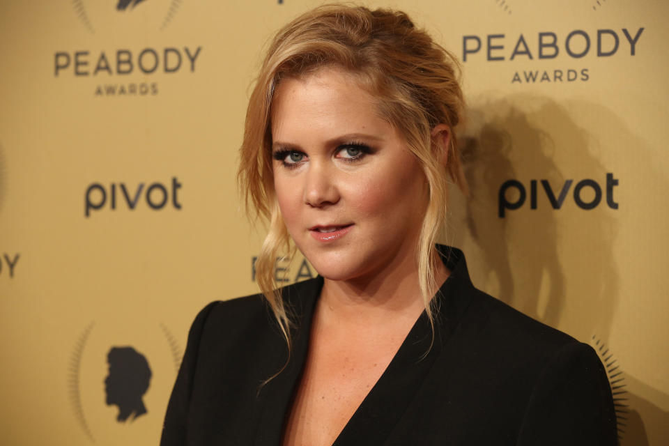 Amy Schumer at the Peabody Awards wearing a black dress