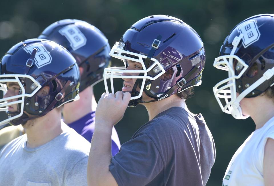 Bourne football player Aiden Crowley, center, joins teammates during an early season workout last Saturday on the school's practice field.
