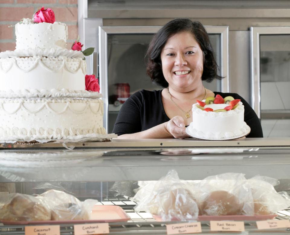 Jenny Voll poses for a photo at her Gahanna bakery, Golden Delight, one of the businesses participating in Asian Restaurant Month.