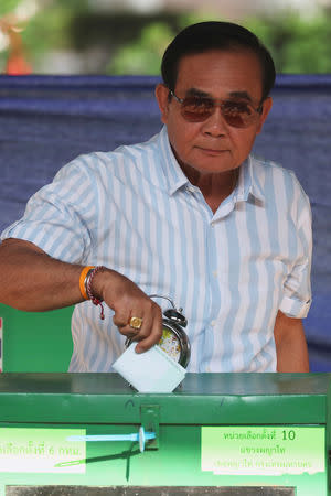 Thailand's Prime Minister Prayuth Chan-ocha casts his ballot to vote in the general election at a polling station in Bangkok, Thailand, March 24, 2019. REUTERS/Athit Perawongmetha