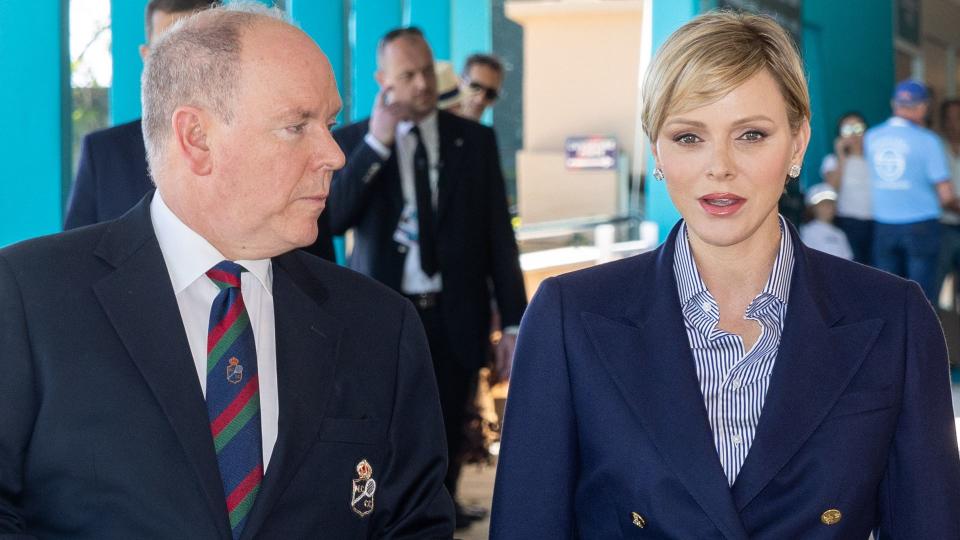 Prince Albert, Princess Charlene and Prince Jacques in pale trousers and dark jackets