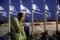 <p>A man reacts next to a portrait of former Israeli President Shimon Peres, as he lies in state at the Knesset plaza, the Israeli parliament, in Jerusalem on Sept. 29, 2016. (REUTERS/Ammar Awad) </p>