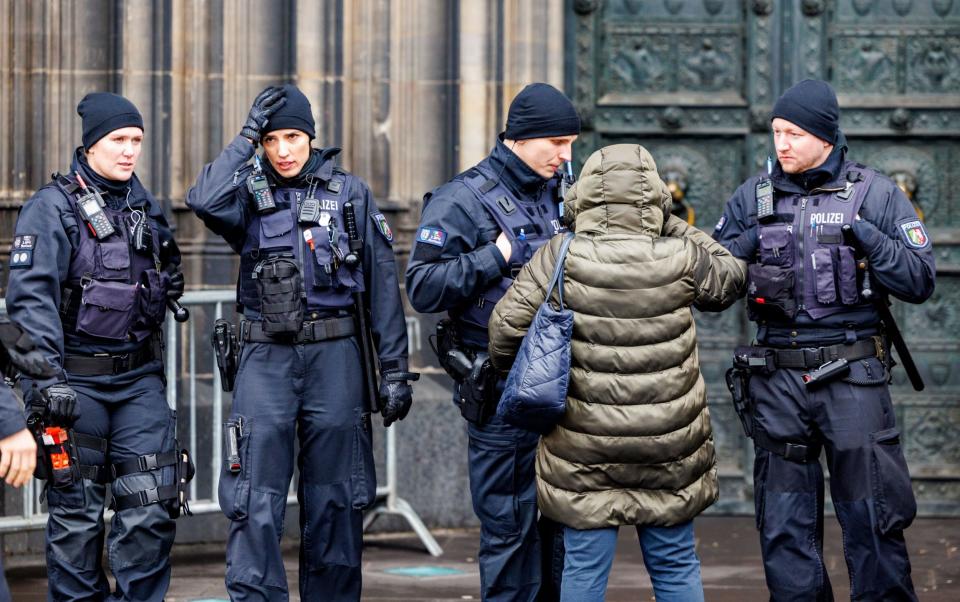 German police patrol Cologne Cathedral on Christmas Eve