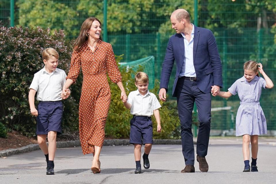 Prince George, Princess Charlotte and Prince Louis (C), accompanied by their parents the Prince William, Duke of Cambridge and Catherine, Duchess of Cambridge, arrive for a settling in afternoon at Lambrook School