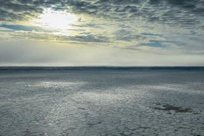 The open water is just visible in the distance from above the ice pack over the Arctic in September.