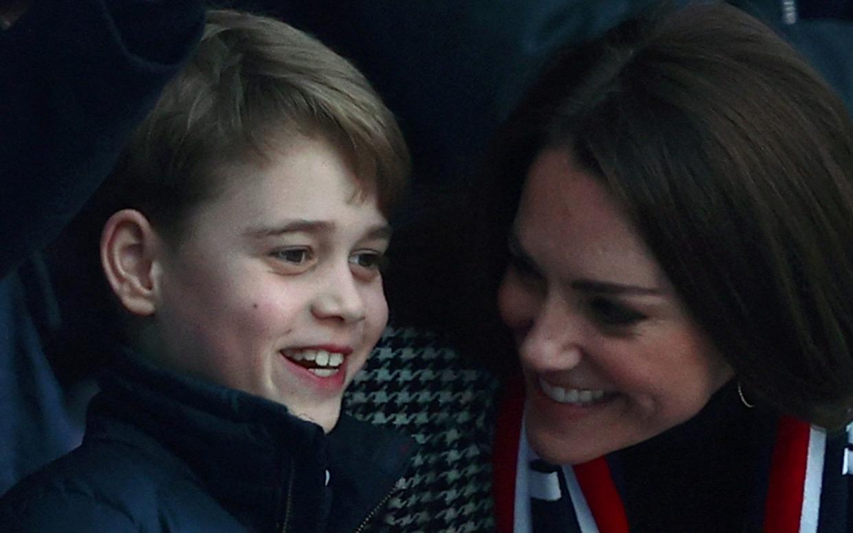 Prince George talks to his mother at Twickenham Stadium on February 26 - AFP