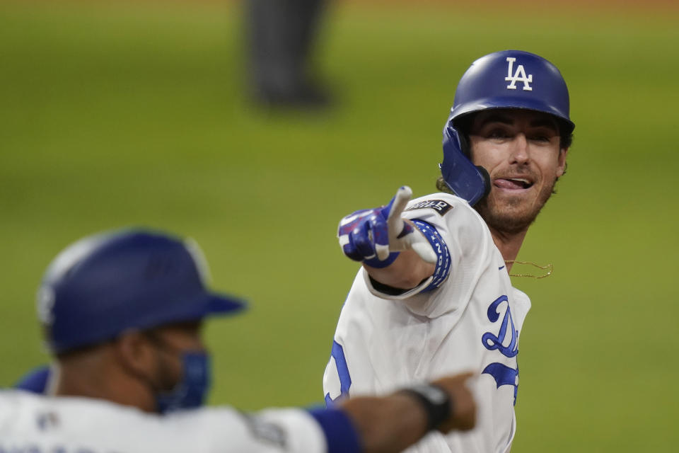 Los Angeles Dodgers' Cody Bellinger celebrates his two-run home run against the Tampa Bay Rays during the fourth inning in Game 1 of the baseball World Series Tuesday, Oct. 20, 2020, in Arlington, Texas. (AP Photo/Eric Gay)