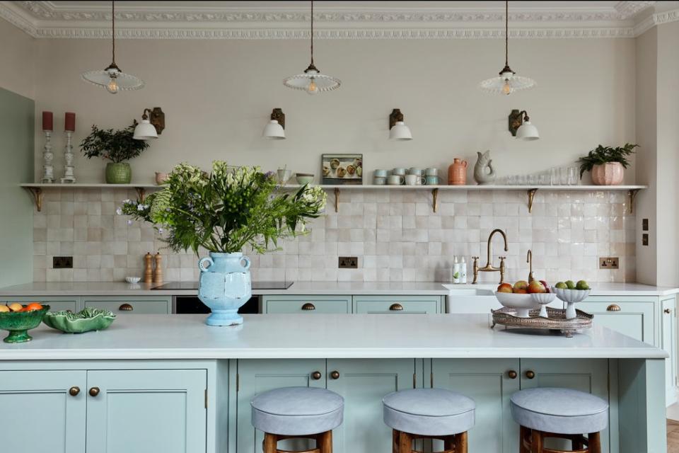 An island with s-shaped curving, and without a hob or a sink, was designed to look like a vintage butcher’s block (Chris Snook Photography)