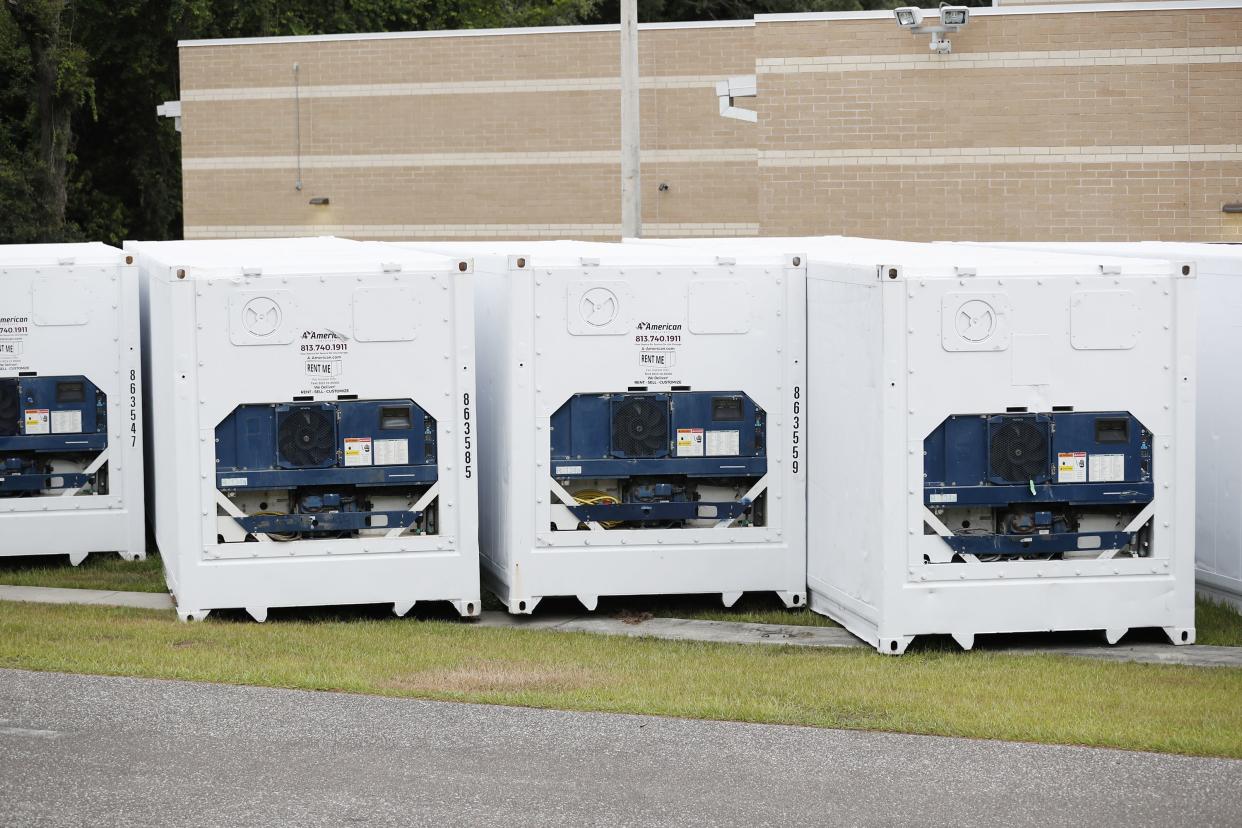 Refrigerator trailers sit outside of the Hillsborough County Medical Examiners Office on July 6, 2020 in Tampa, Florida. Florida is experiencing another surge in COVID-19 cases after reopening in early June, with cases surpassing 200,000 on Sunday.