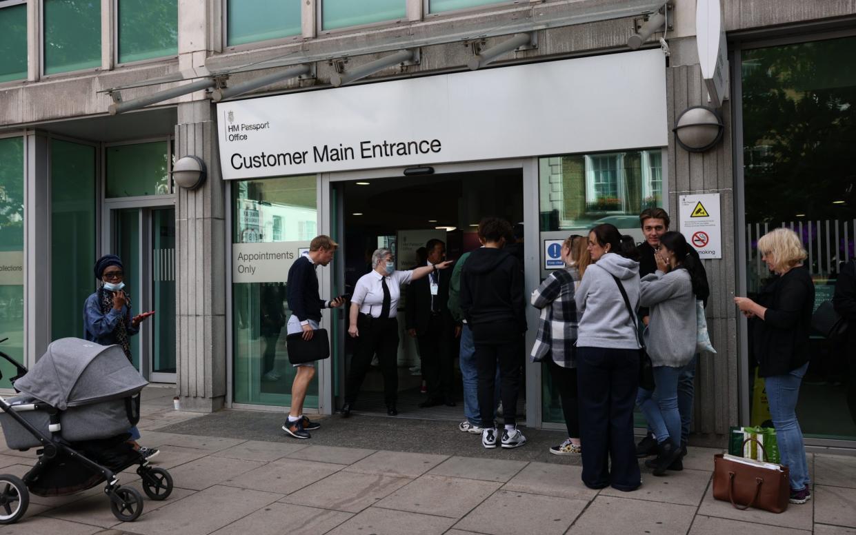 People line up outside HM Passport Office - Hollie Adams for The Telegraph 