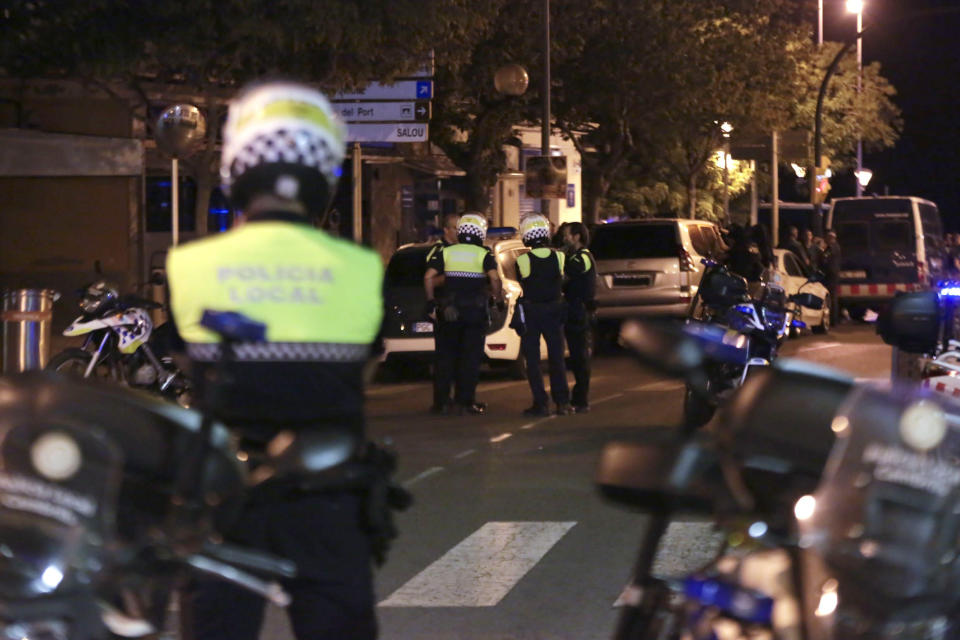 <p>Spanish Policemen inspect a street in Cambrils (Tarragona), northeastern Spain, Aug. 18, 2017, where at least four suspected terrorists have been killed by the police after they knocked down six people with their car at Paseo Maritimo. (Photo: David Gonzalez/EPA/REX/Shutterstock) </p>