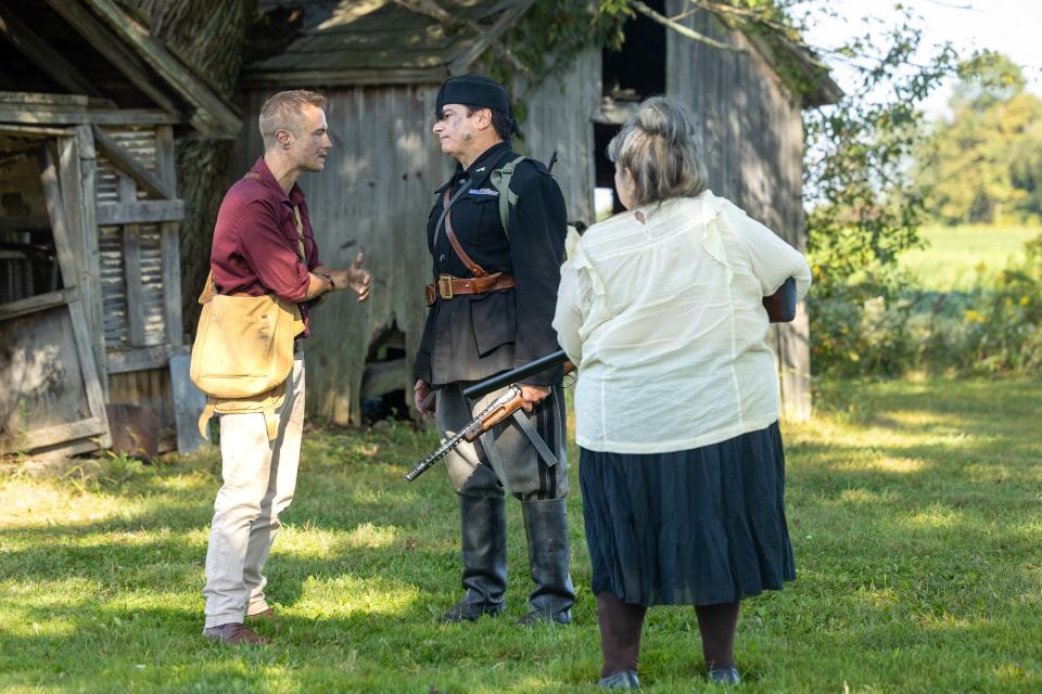 Director Matt Zaleski, left, acts out a scene with fellow actor and producer Chuck French, center, and actress Marianna Alacchi on the set of the new World War II film “Quarter Given,” being filmed locally in Mantua and other places across the region.