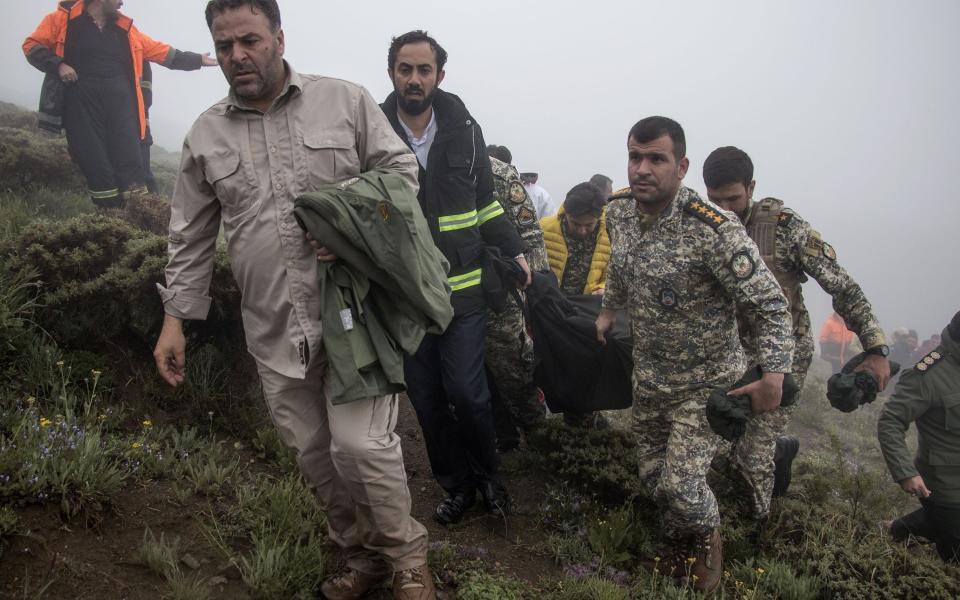 Iranian rescue workers recover bodies of victims of President helicopter crash, Varzaghan, Iran Islamic Republic Of - 20 May 2024