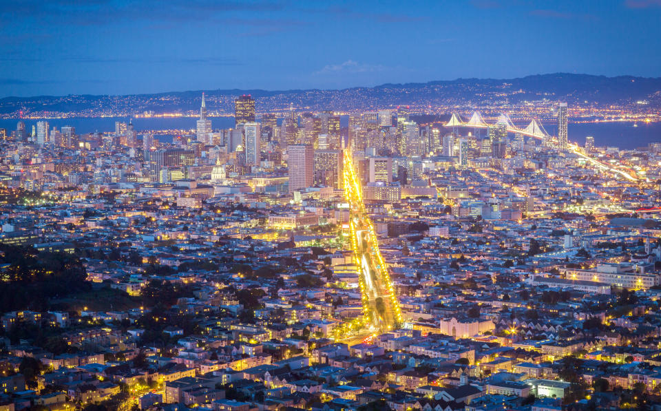 San Francisco at night, with Market Street lit up. Private cars are now banned on the thoroughfare.&nbsp; (Photo: uschools via Getty Images)