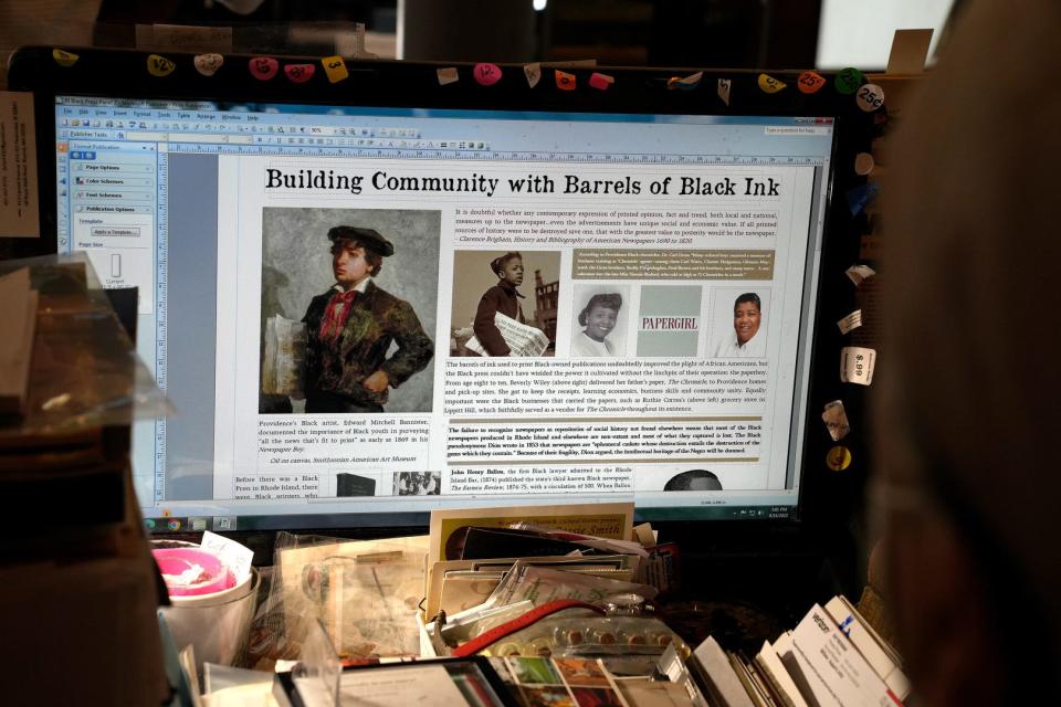 Robb Dimmick shows layouts for some of the displays for Stages of Freedom's upcoming exhibit "Black Ink on White Paper: The African American Press in Rhode Island."