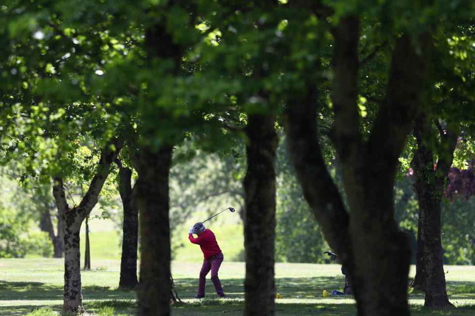 A golfer tees off at Wells Golf Club.