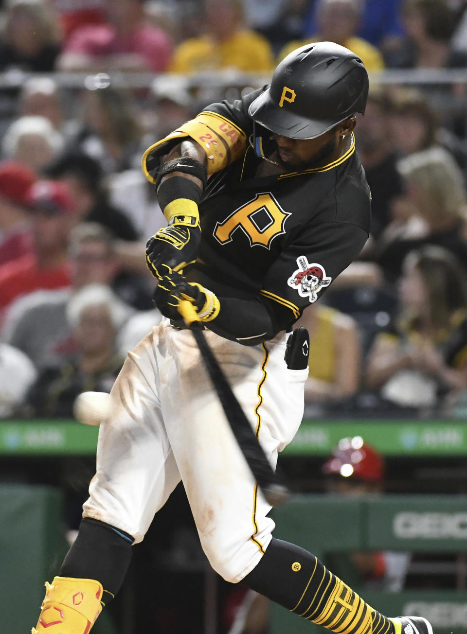 Pittsburgh Pirates' Rodolfo Castro hits a solo home run off Cincinnati Reds pitcher Justin Dunn during the fourth inning of a baseball game, Saturday, Aug. 20, 2022, in Pittsburgh. (AP Photo/Philip G. Pavely)