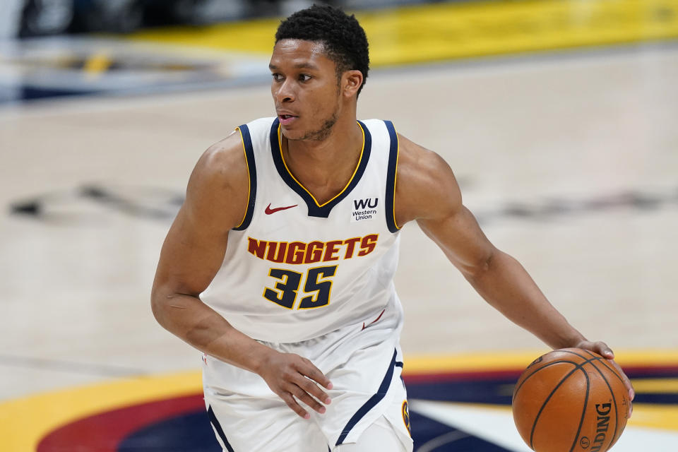 FILE - Denver Nuggets guard PJ Dozier (35) plays against the Memphis Grizzlies in the second half of an NBA basketball game Monday, April 26, 2021, in Denver. The Boston Celtics announced Thursday, Feb. 10, 2022, they've traded guard PJ Dozier and forward Bol Bol, along with a future second-round pick and cash to the Orlando Magic in exchange for a future second-round pick. Dozier and Bol came to Boston in January from Denver as part of a three-team trade. (AP Photo/David Zalubowski, File)