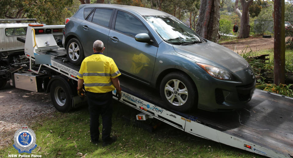 The Mazda seized from a Gymea home in the search for William Tyrrell on the back of a tow truck. 