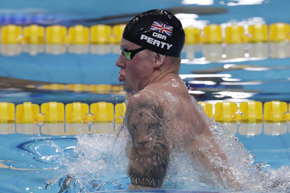 Inked: Adam Peaty competes in the 100m breaststroke in Budapest: AP