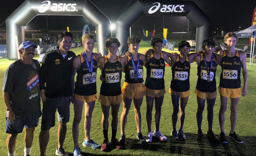 The Newbury Park boys' cross-country team poses for a photo after winning the 2021 Woodbridge Invitational on Sept. 18.