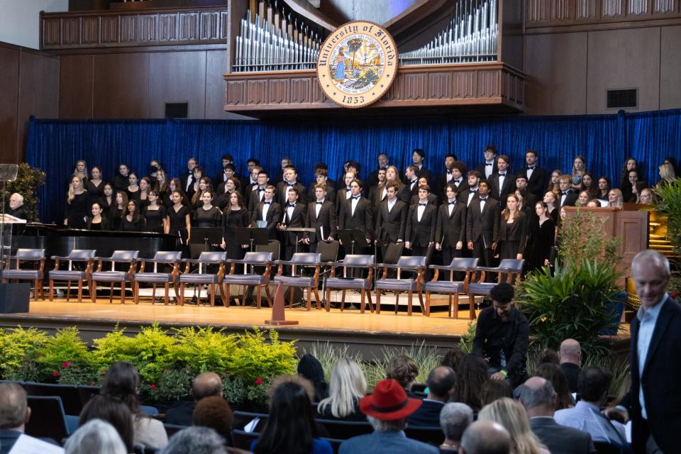 The University of Florida chorus stands on the university auditorium stage in Gainesville.