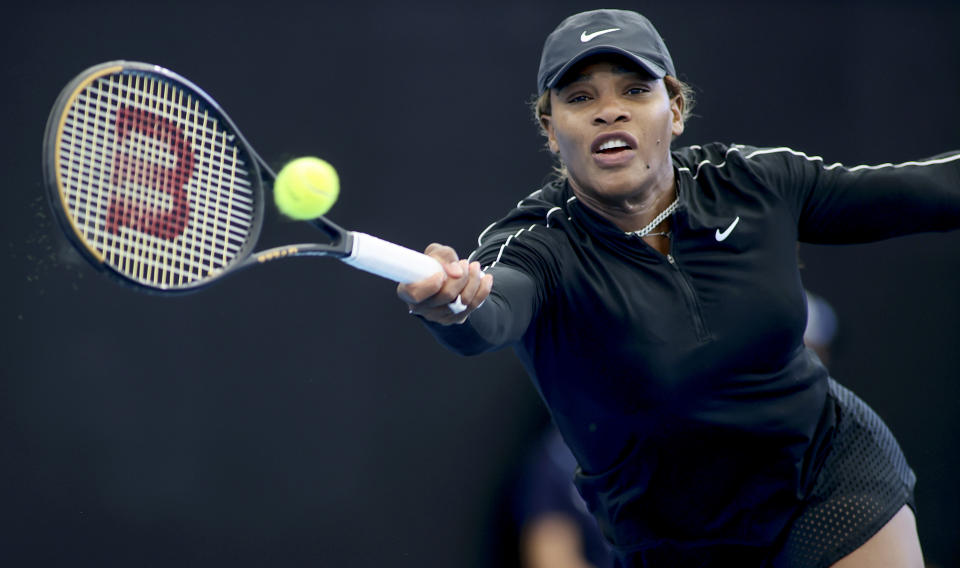 United States' Serena Williams plays a forehand return to Japan's Naomi Osaka during an exhibition tennis event in Adelaide, Australia, Friday, Jan. 29. 2021. (Kelly Barnes/AAP Image via AP)