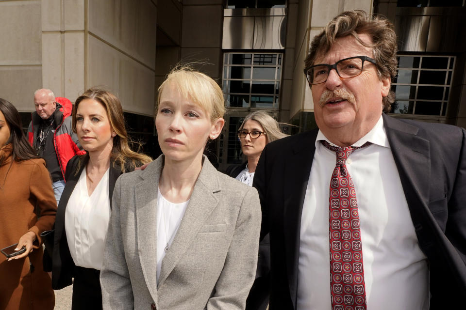 FILE - Sherri Papini of Redding leaves the federal courthouse accompanied by her attorney, William Portanova, right, in Sacramento, Calif., April 13, 2022. During a virtual hearing Papini accepted a plea bargain with prosecutors and pleaded guilty, Monday, April 18, 2022, to a single count of mail fraud and one count of making false statements. She will be sentenced on July 11, 2022. (AP Photo/Rich Pedroncelli, File)