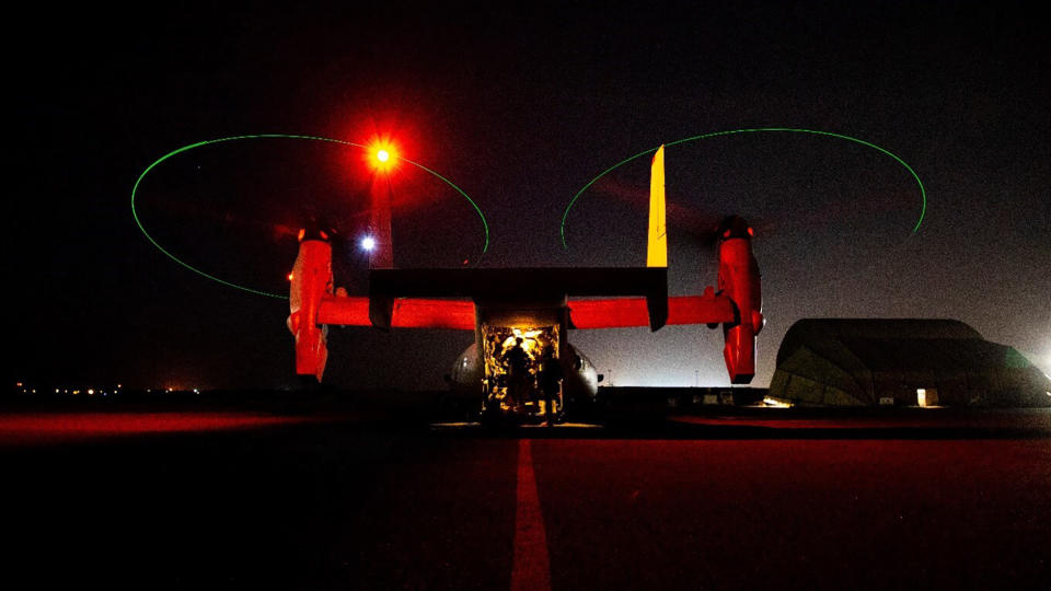 In this photo provided by U.S. Department of Defense, the Army's AH-64 Apache helicopter from 1st Battalion, 227th Aviation Regiment, 34th Combat Aviation Brigade, prepares to conduct overflights of the U.S. Embassy in Baghdad, Iraq, Tuesday, Dec. 31, 2019. Helicopters later launched flares as a show of presence while providing additional security and deterrence against protesters. (U.S. Army photo by Spc. Khalil Jenkins, CJTF-OIR Public Affairs via AP)