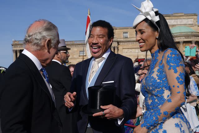 Yui Mok - WPA Pool/Getty King Charles III speaks with Lionel Richie and Lisa Parigi, May 2023